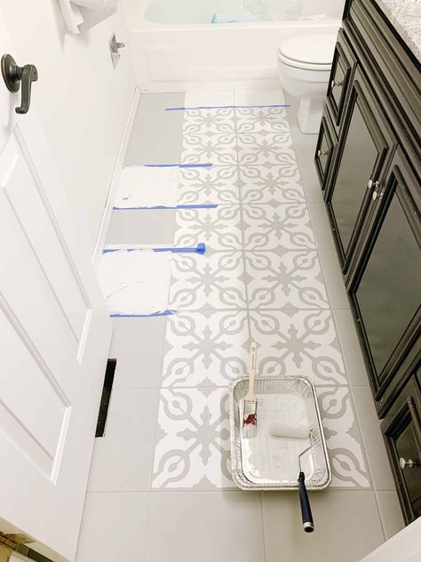 Check out this blog post to see how I painted and stenciled these tile bathroom floors to take them from drab brown tile to this gorgeous grey and white tile for under $100. https://arinsolangeathome.com #DIY #PaintedTile #paintedbathroomfloors How To Stencil Tile Floor, Bathroom Tile Stencil, Stenciled Tile Floor, Renovation Parquet, Painted Bathroom Floors, Painting Bathroom Tiles, Paint Tile, Mini Bathroom, Tile Painting