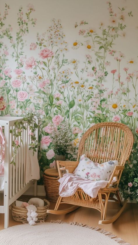 nursery with floral mural and wicker rocking chair Garden Nursery Ideas Plants, Garden Theme Nursery Girl, Wild Flower Baby Nursery, Baby Girl Wildflower Nursery, Baby Girl Nursery Wildflower, Garden Baby Nursery, Whimsical Nursery Ideas, Flower Nursery Baby Girl, Wildflower Nursery Theme