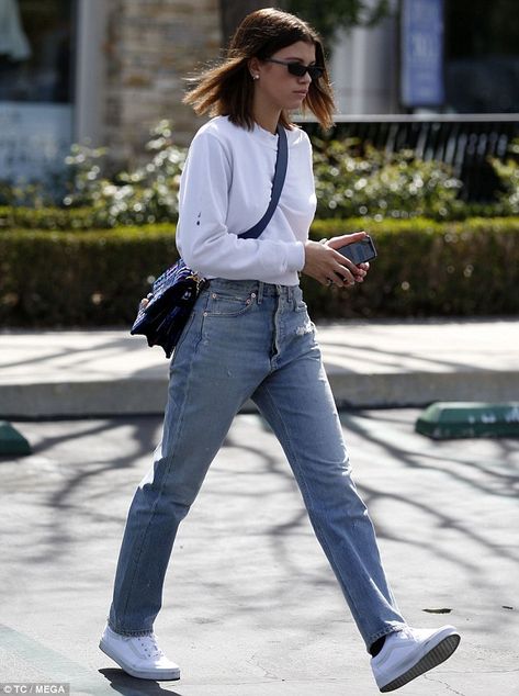 On her own: The beauty is often seen accompanied by boyfriend Scott Disick, 34... Sweater And Mom Jeans, Mom Jeans Outfit Winter, Jeans Heels Outfit, White Cropped Sweater, Calabasas California, Ripped Jeggings, Jeans Outfit Winter, Camila Morrone, Mom Jeans Outfit