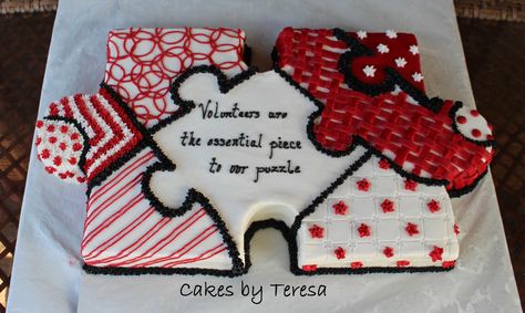 Red Cross puzzle cake. Cake is carved into puzzle piece shape, then decorated with buttercream. Puzzle Piece Cookies Decorated, Puzzle Piece Cake, Puzzle Cake Ideas, Puzzle Birthday Cake, Puzzle Cake, Colleague Gifts, Grandma Cake, Puzzle Quotes, August Birthdays