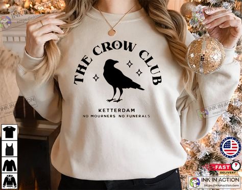 Ketterdam Crow Club Shirt, Six of Crows Check more at https://goldenandhoodie.com/ketterdam-crow-club-shirt-six-of-crows-2025/ Crow Club, Book Merch, Six Of Crows, Club Shirts, Crows, Hoodie Shirt, Going Out, Fan, Pins