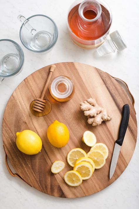 Flu Season Ginger Honey Lemon Tonic Drink. Looking for ideas and remedies for food when you're feeling sick, have a cold, or have a sore throat? This is delicious and great tasting for kids, but even better for adults as cocktails if you add bourbon or whiskey. Like homemade cough syrup or medicine that will have you feeling better in no time. Lemon Tonic, Honey And Lemon Drink, Honey Aesthetic, Homemade Cough Syrup, Ginger Honey Lemon, Eco Food, Tonic Drink, Ginger Honey, Honey Photography