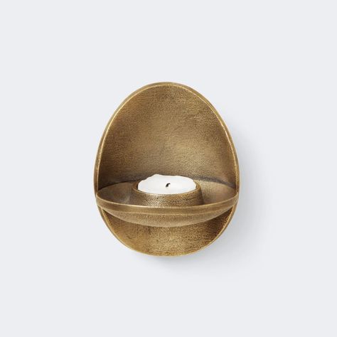 Ferm Living Agapé Wall Tealight Holder: Spiritual Warmth and Timeless Elegance Inspired by Spiritual Love Named after the Greek word for ‘spiritual love and charity,’ the Ferm Living Agapé Wall Tealight Holder is made from recycled cast aluminum. Its rustic surface creates a captivating ambience, filling your space with warmth and a sense of spirituality. Functional and Timeless Design Designed to hold a tea light, this wall-mounted holder effortlessly blends functionality with elegance. Its sim Copenhagen Furniture, Hasami Porcelain, Candle Mirror, Spiritual Love, Decorative Planters, Tealight Holder, Ottoman Table, Portable Lamps, Ferm Living