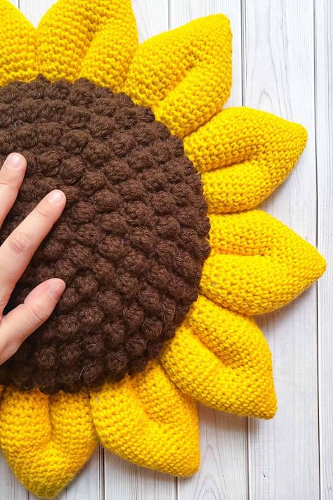 Crochet Sunflower Pillow Pattern - thecaffeinatedsnail.com Crochet Sunflower Pillow Pattern Free, Crochet Fall Pillow, Sunflower Pillow Crochet, Brown Crochet Ideas, Crochet Sun Pillow, Sunflower Pillow Pattern, Sunflower Crochet Pattern, Yarn Weights, Sunflower Pillow