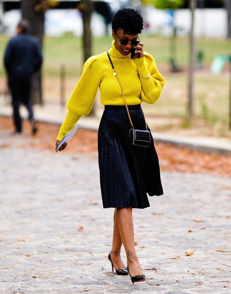 woman wearing marigold yellow sweater