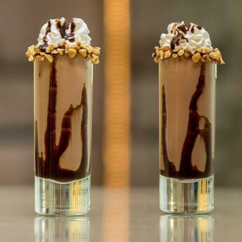 These little Nutella Shooters taste like gulps of Heaven in your mouth — trust us, that's no hyperbole. These creamy, chocolate dessert cocktails mix up Frangelico, Irish cream, and Nutella, and are garnished with whipped cream, chocolate syrup, Nutella, and chopped nuts for even more Nutella sundae mixed drink tastiness. Nutella Shooters, Frangelico Drinks, Awesome Cocktails, Creamy Chocolate Dessert, Shots Alcohol Recipes, Birthday Cocktails Recipes, Dessert Cocktails, Whipped Cream Chocolate, Shooter Recipes