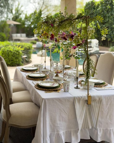 Some snapshots of my Garden Tea Party table, complete with floral dishes, a ruffled white tablecloth, and my favorite table rod adorned with hanging jars of fresh flowers and dancing butterflies 🦋🌸🍃 🦋Comment LINK for a link of items on this table to be sent to your inbox. Or visit the link in my bio. #tablescape #springtablescape #alfrescodining #mikasalifestyle #teaparty #ltkhome Over Table Rod, Over The Table Rod, Hanging Jars, Tea Party Table, Spring Tablescapes, Tea Party Garden, Fall Dinner, White Table Cloth, Family Party