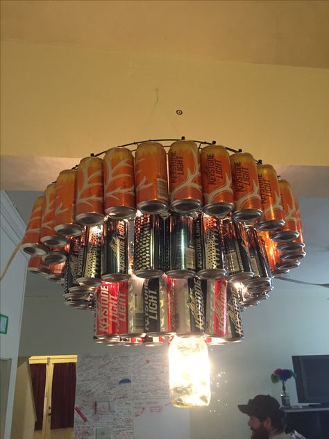 Chandelier made from beer cans, mason jar center filled with string lights. #metalart #scrapart Beer Can Lights Diy, Soda Can Lights Diy, Beer Can Chandelier, Coors Light Party Ideas, Mason Jar Center, Coors Banquet, White Trash Bash, Trash Bash, Beer Cans