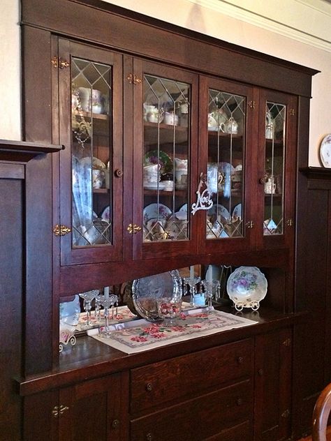 Built-in dining room china cabinet, our 1914 Craftsman home   #craftsman #bungalow #home #interior #built_in #cabinet #cupboard #china #plate_rail #wainscoting Dining Room China Cabinet, Mirrored Backsplash, Plate Rail, Craftsman Interior Design, Wide Doors, Leaded Windows, Craftsman Houses, Flush Hinges, Built In China Cabinet