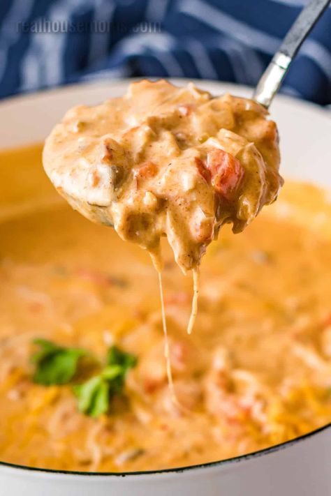 Everybody raves over Crock Pot King Ranch Chicken Soup. It's a super easy, crave-worthy meal that tastes just like your favorite casserole! #realhousemoms #crockpot #kinfranchchicken #chickensoup #soup #slowcooker #comfortfood #chicken #cheese #bellpepper #creamcheese #tacoseasoning Cool Ranch Doritos Cheese Soup, Crockpot King Ranch Chicken Soup, King Ranch Soup, Rotisserie Chicken Soup Crockpot, Crockpot Soup With Chicken, Creamy Chicken Soup Crockpot, Crockpot Chicken Soup Recipes, King Ranch Chicken Soup, Crock Pot Chicken Soup