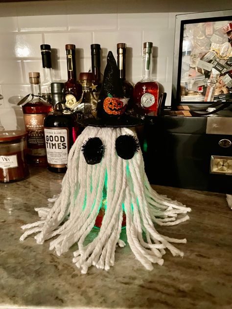 Items needed: Tall glass, mop head, witch hat, felt and/or pompoms for eyes, pumpkin light, hot glue gun Mop Head Witch, Mop Ghost, Eyes Pumpkin, Mop Heads, Pumpkin Lights, For Eyes, Hot Glue Gun, Glue Gun, Witch Hat