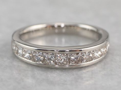 "This vintage wedding band is set with a glittering row of square-cut, fine high-quality diamonds. The look they create is very 'Deco', and very modern at the same time! Channel settings never go out of style! The effect of one long row of diamonds, one band of glittering bright light, across the finger is always popular and always lovely. The sides of the ring completely encase the diamonds, keeping them safe and secure, which makes these rings easy to wear every day!  Metal: Platinum  Gem: 12 Wedding Ring Princess Cut, Wedding Ring Princess, Channel Set Diamond Band, Channel Set Wedding Band, Ring Princess Cut, Channel Set Rings, Band Wedding Ring, Vintage Wedding Band, Princess Cut Diamond