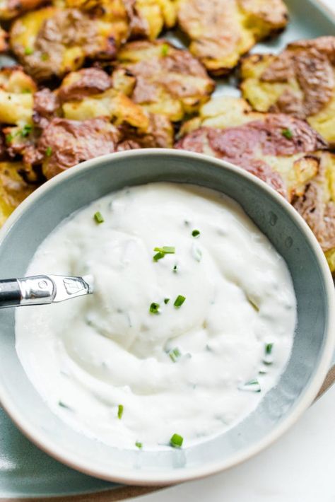 Crispy Smashed Potatoes Recipe with Sour Cream and Chive Sauce Sour Cream And Chives Potatoes, Smashed Potato Dipping Sauce, Sour Cream Dip For Potatoes, Potato Dipping Sauce Sour Cream, Sour Cream Chive Potatoes, Dip For Smashed Potatoes, Sour Cream Sauce For Potatoes, Sour Cream And Chive Potatoes, Sauce For Smashed Potatoes