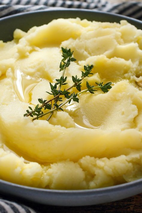 NYT Cooking: These mashed potatoes are extremely easy to make, and have the added benefit of being vegan. A hefty dose of garlic lends a bite to the creaminess. Make sure to use good olive oil. (For everything you need to know to make perfect potatoes, visit our <a href="http://cooking.nytimes.com/guides/how-to-make-potatoes">potato guide.</a>) Olive Oil Mashed Potatoes, Nyt Cooking, Parsley, Mashed Potatoes, Olive Oil, Garlic, Thanksgiving