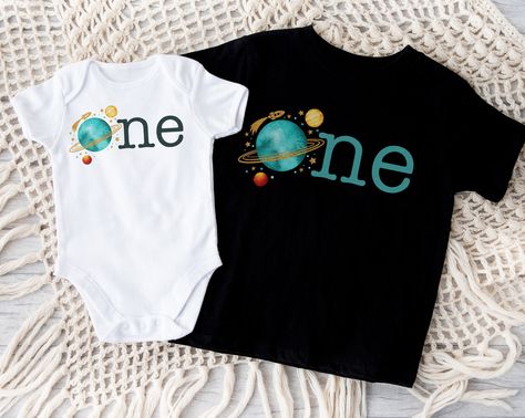 This fun and bold First Trip Around the Sun Planet t shirt or bodysuit is perfect for your little one's first birthday party or anytime. Great addition to a Planet birthday party theme. Shirt has shoulder-to-shoulder taping for enhanced durability at stress points, and double-needle stitching on the sleeves and bottom hem. The side-seam construction adds a classic, stylish touch while the Easy Tear™ label ensures no scratching discomfort, and no skin irritation. Bodysuit bindings are made with r 1st Trip Around The Sun Birthday Shirt, First Trip Around The Sun Shirt, 1st Trip Around The Sun Birthday Party, Sun Planet, Planet Birthday, Sun Birthday, Boys First Birthday Party Ideas, First Birthday Shirt, Boys 1st Birthday Party Ideas