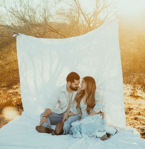 Sheet editorial photoshoot couple in the desert in front of a white bed sheet. Unique and creative engagement photos with prisms. Sheet Couple Photoshoot, White Sheet Field Photoshoot, White Sheet Couples Shoot, White Sheet Photoshoot Outside Couple, White Sheet Photoshoot Couples, White Sheet Photoshoot Outside, Sheet Photoshoot Photo Ideas, White Sheet Photoshoot, Sheet Backdrop