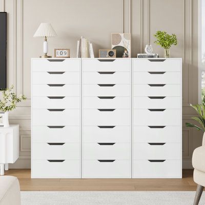 This 8-drawer dresser brings a modern look and clean lines to your bedroom. Made from engineered wood in a crisp white finish, it features a vertical orientation that saves floor space while offering ample storage. This dresser includes eight drawers with ball-bearing glides for smooth operation - the top four smaller drawers are ideal for cosmetics and electronics, while the bottom four larger drawers accommodate clothing, scarves, and socks. Plus, the dresser comes with an anti-tip device for Dresser Alternative Storage, Clean Dresser, Cricut Organization, Big Kid Bedroom, Apartment Needs, Work Studio, 8 Drawer Dresser, Bedroom Drawers, Closet Drawers