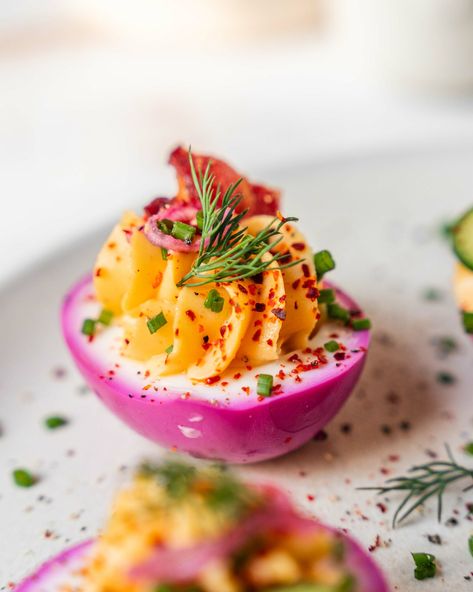 Try my Perfectly Pink Deviled Egg Recipe! A unique twist on a classic, adding a pop of colour and delicious flavour to your appetiser lineup. Cute Devilled Eggs, Pickled Beet Deviled Eggs, Beet Dyed Deviled Eggs, Deviled Eggs Tulips, Deviled Eggs Easter Ideas, Pink Devilled Eggs, Deviled Egg Flavors, Spring Deviled Eggs, Valentine Deviled Eggs