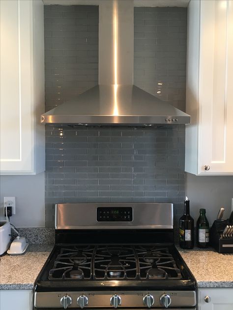 Our kitchen reno! Glass backsplash behind the gas stove and range hood. Behind Stove Backsplash, Kitchen Herringbone, Chevron Backsplash, Stove Range Hood, Trendy Kitchen Backsplash, Stove Backsplash, Steel Backsplash, Grey Backsplash, Beadboard Backsplash