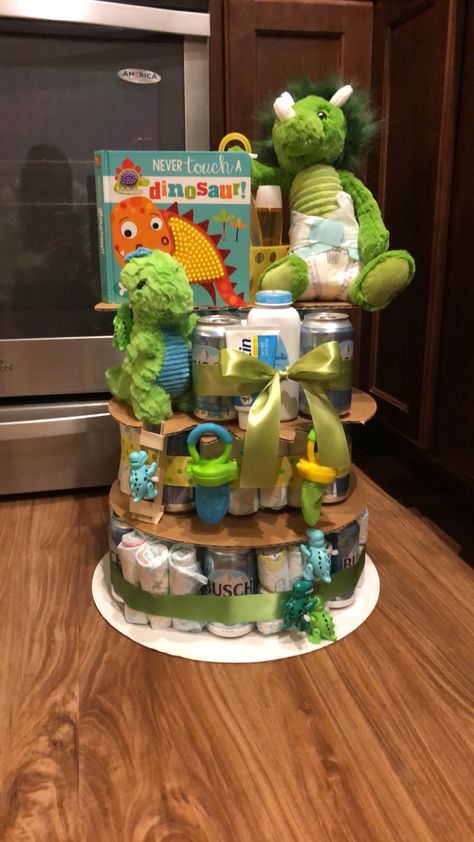 Gender Reveal Ideas Dinosaur, Dinosaur Theme Baby Shower Ideas, Dinosaur Baby Shower Ideas For Boys Decorations, Dinasour Baby Shower Theme, Dinosaur Baby Shower Cake, Dinosaur Diaper Cake, Dino Diaper Cake, Dino Baby Shower Ideas Boys, Dinosaur Baby Shower Ideas