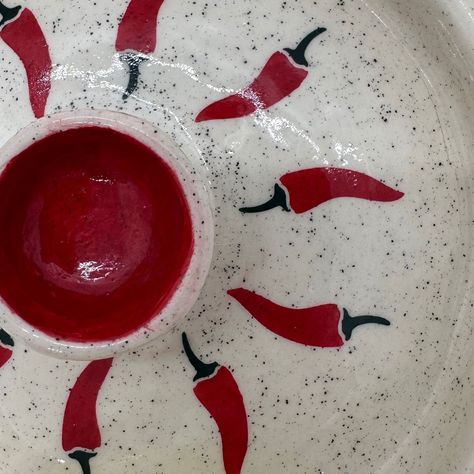 Handcrafted ceramic chip and dip plate, adorned with chilli decoration, in yellow, red and white colour. Swipe left to see more details >> #handcrafted #handcraftedceramics #handcraftedpottery #ceramiclovers #potterylovers #platters #spicefood #mexicancuisine #frenchfries #redcolor #yellowcolor #lovekillspottery Chilli Pottery Painting, Chilli Decorations, Handcrafted Pottery, Chip And Dip, Handcrafted Ceramics, White Colour, Pottery Painting, Yellow Color, White Color