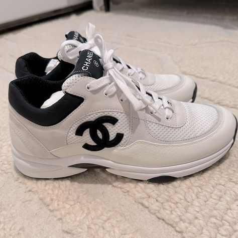 Brand New Chanel White With Black Cc Coco Mark Trainer Sneakers Chanel White Black Leather Cc Logo Runner New With Box Mesh, Suede Calfskin & Grained Calfskin Lace Up Tie Front Chanel Black Cc Side Logo White Suede Calfskin And White Calfskin Material Large Cc Bottom Logo Size 41, Fits A Us 10-10.5 Sold Out In Stores Chanel Outfits Women, Chanel Tennis Shoes, Chanel Trainers, Sneakers Chanel, Chanel 2023, Trainers Outfit, Chanel Casual, Chanel Sneakers, Chanel White