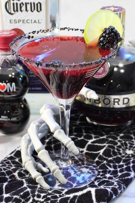 Closeup of skeleton hand grabbing cocktail with ingredients around it. Black Margarita, Blackberry Margarita, Halloween Drinks Alcohol, White Cranberry Juice, Halloween Parejas, Keto Cocktails, Halloween Cocktail, Silver Tequila, Dirty Thirty