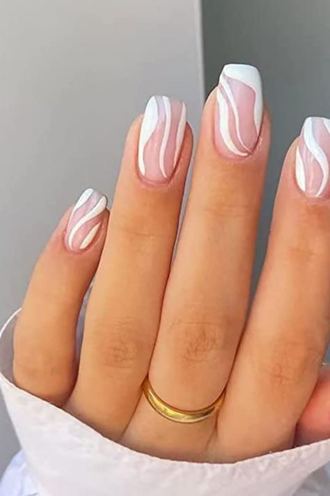 If you're looking for a creative and stylish way to express yourself this summer, white swirl nails are the way to go! Perfect for proms, weddings, special events, and summer fashion, our white swirl nails will guarantee you a unique and glamorous look. With an easy-to-apply and long lasting formula, these nails will be the perfect Mother's Day gift or 'just because'! Click the link to learn more and get your summer nails look on-point. * Affiliate Link White Swirl Nails, White Summer Nails, Acrylic Nail Designs Coffin, Pale Pink Nails, Swirl Nails, Uk Nails, Press On Nails Short, Gel Nail Art Designs, Nails Medium