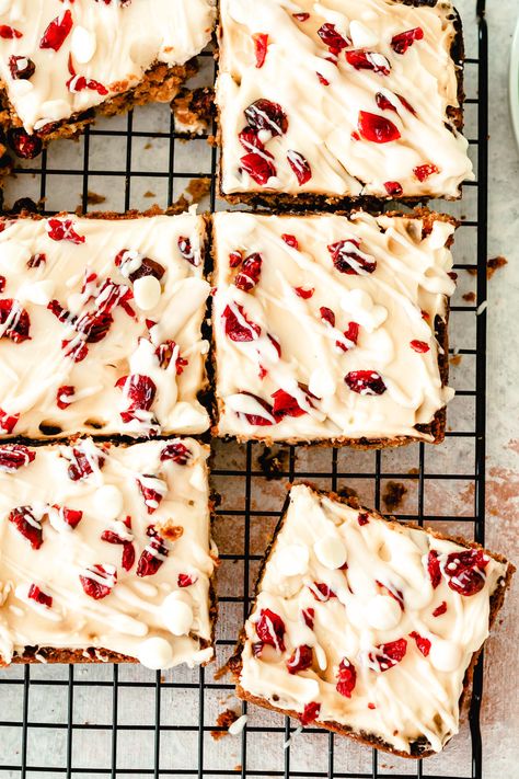 Cranberry Bliss Bars are a copycat version of the bars you find at Starbucks. These bars are festive, sweet and the perfect holiday treat. The bars mix together white chocolate with dried cranberries and are topped with a cream cheese frosting. These would be great in holiday gift tins too! // acedarspoon.com #bars #dessert #cranberry #blissbars #starbucks Bliss Bars Recipe, Almond Energy Bites, Cranberry Almond Energy Bites, Bliss Bars, Cranberry Bliss, Bliss Bar, Cranberry Bars, Cranberry Bliss Bars, No Bake Energy Bites