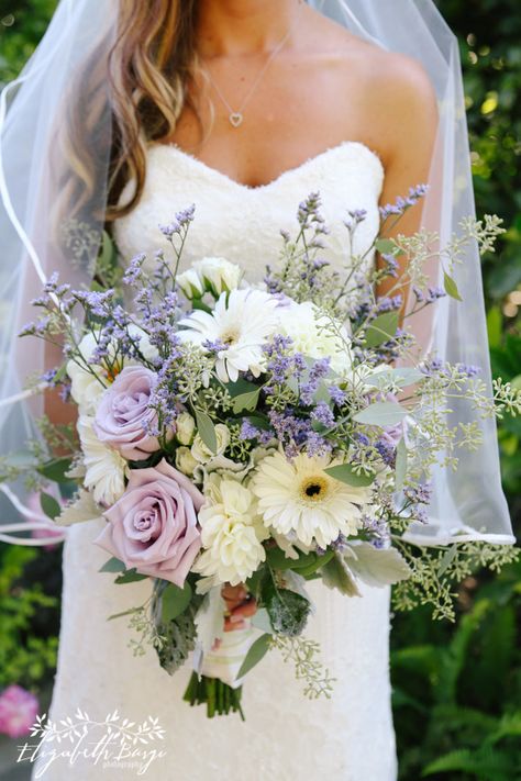 Bridal bouquet of lavender roses, white dahlias, white gerbera daisies, misty maine, dusty miller & eucalyptus White Flowers With Lavender, Lavender Dahlia Bouquet, Purple Gerbera Daisy Bouquet, Daisy Eucalyptus Bouquet, Wedding Bouquet Lavender Eucalyptus, Lavender And Sage Wedding Bouquet, Bridal Bouquet Purple Lavender, White Gerbera Daisy Bouquet, Lavender And Sage Bridal Bouquet