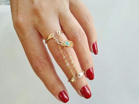 This Beautiful piece features 2 adjustable gold filled ring bands, they are connected by a 2 gold filled chain and on the middle a delicate tiny Hamsa charm. The charm is 10mm, the distance between both rings is 1.6 but I can resize it in case you need. Even if this rings are adjustable Gold Chain Ring, Hamsa Ring, Rings Dainty, Double Finger Ring, Rings Diy, Ring Bands, Hamsa Charm, Two Rings, Business Products