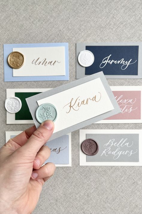 Personalized, calligraphed place cards/escort flat layered cards with a wax seal perfect for weddings, events, or dinner parties! Every card is handwritten in your choice of ink color on your choice of 2 cardstock colors in Letter B Calligraphy's signature modern calligraphy style. Calligraphy Place Cards Wedding, Wax Seal Ideas, Wax Seal Place Cards, B Calligraphy, Calligraphy Place Cards, Diy Place Cards, Layered Cards, Place Cards Wedding, Wedding Name Cards