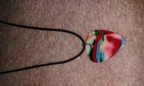 How to Make a Guitar Pick Necklace: 6 Steps (with Pictures) How To Make A Guitar Pick Necklace, Guitar Pick Jewelry Diy, Homemade Carnival Games, Guitar Pick Jewelry, Pick Necklace, Guitar Pick Necklace, Board Game Geek, Jewelry Accessories Ideas, Treble Clef