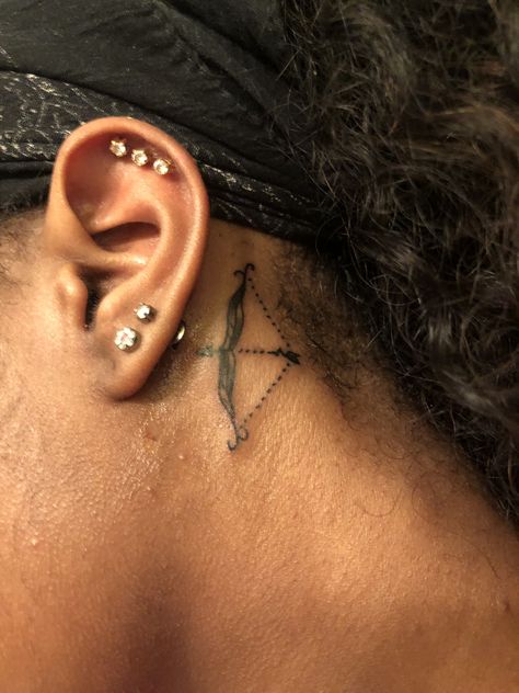 Sagittarius tattoo behind ear Sagittarius Neck Tattoo, Sagittarius Behind The Ear Tattoo, Small Sagittarius Tattoos For Women, Sag Tattoo, Sagittarius Tattoo Designs, Sagittarius Tattoo, Piercing Chart, Ear Piercings Chart, Double Ear Piercings