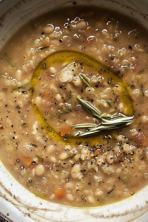 A rustic bowl of Italian farro soup filled with tender beans and vegetables, drizzled with olive oil and garnished with rosemary, perfect for a comforting meal. Farro Soup Recipes, Farro Soup, Beans And Vegetables, Comfort Soups, Italian Bowl, Recipes Veggie, Rustic Bowl, Italian Sausage Soup, Yummy Fall Recipes