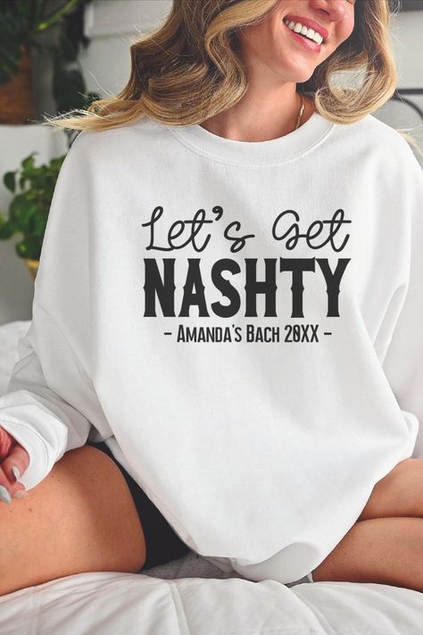 Looking for the perfect bachelorette party gift? Look no further than this Nashville Bachelorette LET'S GET NASHTY Custom Bridesmaid Sweatshirt! This hilarious sweatshirt is sure to put a smile on any bride-to-be's face, and will be a favorite among her bridal party members. This sweatshirt is comfortable and stylish and is a great way to show your support for your friend as she prepares for her big day. This crewneck sweatshirt also matches our NASHTY BRIDE crewneck sweatshirt. Rodeo Wedding, Bride Crewneck, Bach Gift, Cowgirl Bachelorette Shirts, Country Bachelorette, Nashville Bachelorette Party, Cowgirl Bachelorette, Bachelorette Party Gift, Bridal Party Outfit