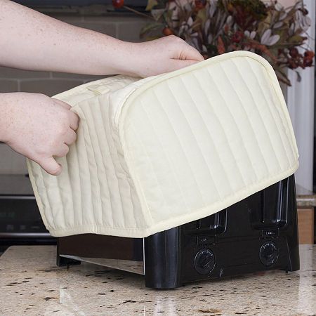 The Ritz four-slice toaster cover is crafted from a durable polyester/cotton blend. 9" x 11"Included: 1 Appliance Cover(s)Base Material: 60% Cotton, 40% PolyesterCare: Machine WashCountry of Origin: Imported Small Appliance Covers, Kitchen Devices, 4 Slice Toaster, Toaster Cover, Countertop Oven, Appliance Covers, Toasters, Cleaning Appliances, Kitchen Sale