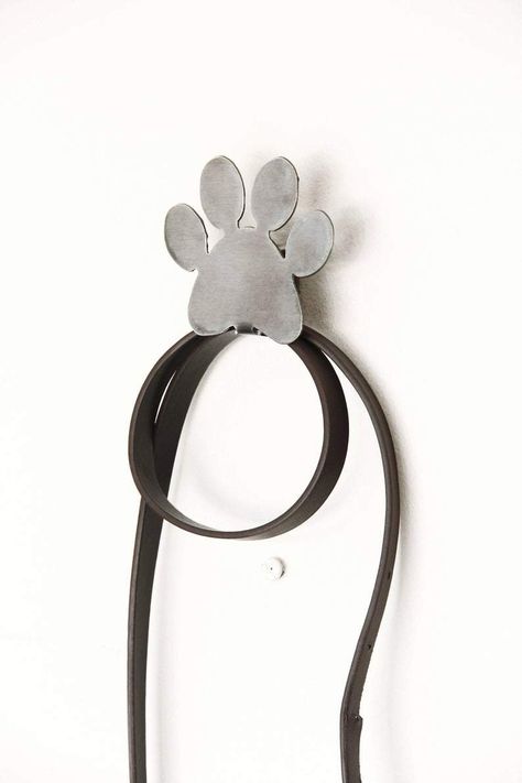 Now your four-legged friend can have it's own dedicated hook in your entry! Perfect for leashes, harnesses, or whatever else needs to be hung!They add an industrial farmhouse touch and make the perfect gift. This gift is good for any dog lover in your life! Made from high quality carbon steel and powder coated to last a lifetime. Size: 2.5" x 2.75" Coatings: All Powder Coated Black Made in the USA Our typical ship times are 7 business days after order placement. Dog Leash Holder, Pet Organization, Rope Dog Leash, Paw Pattern, Leash Holder, Organization Gifts, Paw Design, Rope Dog, Pet Leash