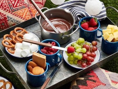 Chocolate Caramel Fondue Recipe | Robin Miller | Food Network Glamping Food, Winter Campfire, Melted Cheese Dip, Homemade Cider, Snacks Dinner, Cozy Winter Recipes, Chocolate Fondue Recipe, Campfire Recipes, Perfect Grilled Cheese