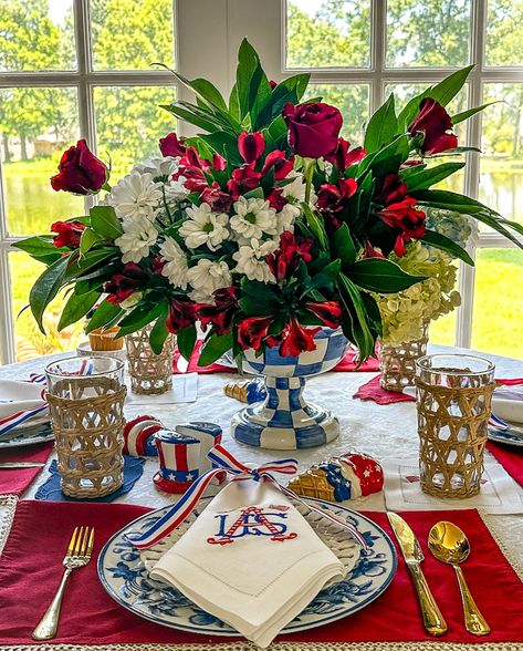 🌟 Celebrating the Fourth in style! 🇺🇸✨ Set the table with elegant blue and white China, custom embroidered USA linen napkins, and a stunning floral centerpiece in a Mackenzie-Childs Royal Check compote. Perfect for a patriotic celebration with a touch of class! 🌺💙 Comment “LINK” to shop this decor and follow for more festive inspiration! . . . . . . . #FourthOfJuly #Tablescapes #HomeDecor #CelebrateInStyle #mackenziechildseveryday Patriotic Centerpieces, Set The Table, Floral Centerpiece, 4th Of July Decorations, Blue And White China, White China, Mackenzie Childs, Touch Of Class, Floral Centerpieces