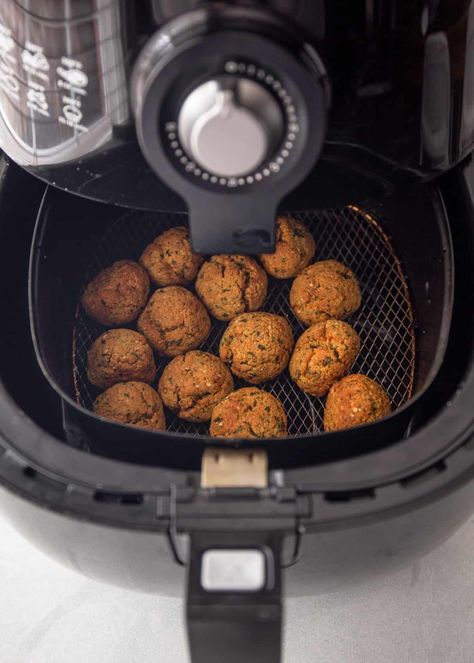 Air fryer falafel is warm and crispy on the outside and packed with aromatic herbs on the inside. Enjoy this healthy vegan dish as a quick snack, an on-the-go lunch, or as the centerpiece of a weeknight family dinner. #vegan #airfryer #easyrecipe Falafel Air Fryer Recipe, Vegan Airfryer, Air Fryer Falafel, Weeknight Family Dinner, Falafel Mix, How To Make Falafel, Dinner Vegan, Dry Chickpeas, Quick Snack