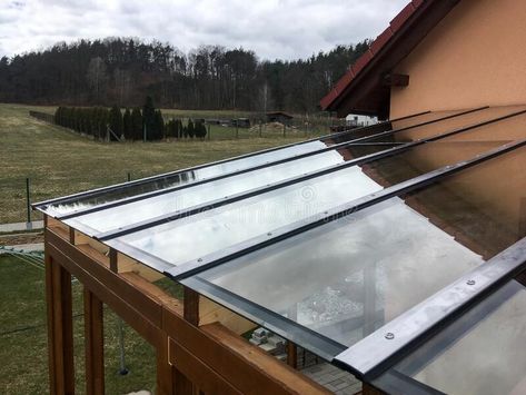 The detail of the transparent glass roof of the wooden pergola. royalty free stock photography Glass Pergola Roofs, Glass Roof Detail, Wood Canopy, House Image, Wooden Pergola, The Modern House, Covered Pergola, Wood Structure, Glass Roof