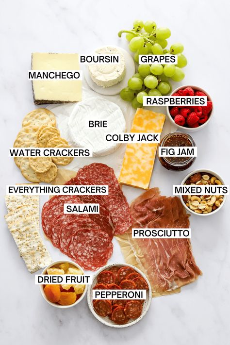 This simple charcuterie board makes the best appetizer for parties or holidays! It is filled with meats, cheeses, crackers, fruits, and nuts and will surely be a hit at your next gathering! Good Charcuterie Board Ideas, Charcuterie Board Catering, Greek Charcuterie Board Ideas, Spanish Charcuterie Board, Charcuterie Board Ideas Dinner, How To Make Charcuterie Board, Lunch Charcuterie Board Ideas, Bring Your Own Board Party Ideas, Lunch Board Ideas