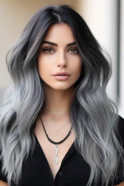 If you’re looking for depth and drama, a silver ombre on a jet-black base offers the best of both worlds. Start with a deep, jet-black color at the roots and smoothly transition to a shimmering silver at the tips. Gray Ombre Hair Silver, Silver To Black Hair, Silver Balayage On Black Hair, Dark Root Silver Hair, Grey Bayalage Hair Dark Roots, Balayage Hair Grey Silver Dark Roots, Grey And White Hair Color, Black With Grey Hair, Ombre Gray Hair Color