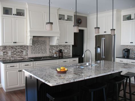 This beautiful contemporary kitchen utilizes Alaskan White granite on the island and Opalescent granite on the perimeters. White Ice Granite Countertops, Modern Kitchen Granite, Alaskan White Granite, Kitchen Design Granite Countertops, White Ice Granite, Grey Granite Countertops, White Granite Kitchen, Backsplash For White Cabinets, White Cabinets White Countertops