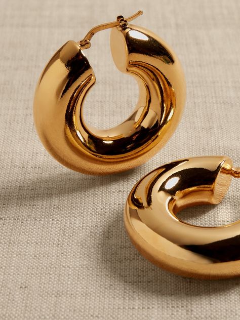 Perfectly-sized polished hoops with a plump profile and hollow core are made of bronze.  Timeless Classics: Luxury, everyday.  A showcase of time-honored craftsmanship and skilled Italian artisans, these are the pieces you'll reach for season after season, delighting in their exceptional versatility and endless appeal.  Hinged post backs.  12K-gold plated or silver-plated bronze.  Made in Italy.  Length: 1. 5" Wedding Stack, Hoop Earrings Aesthetic, Photo Concept, Jewelry Photoshoot, Bronze Earrings, Bling Shoes, Gold Aesthetic, New England Style, England Style