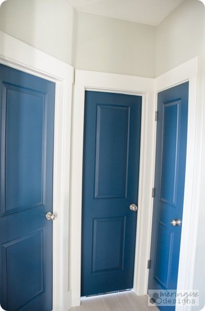 Red Interior Doors, Brick House With Blue Door, Navy Blue Interior Doors, Blue Doors Interior, Navy Interior Doors, House With Blue Door, Painted Chairs Dining Room, Striped Hallway, Blue Interior Doors