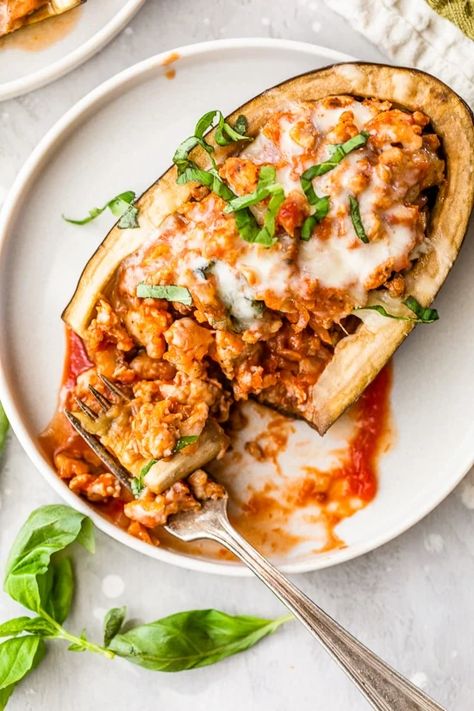 Stuffed Eggplant Parmesan is a fun, easy twist on eggplant parmesan – these baked eggplant "boats" are hollowed out and stuffed with chicken sausage, tomato sauce and mozzarella. #eggplant #stuffedeggplant #eggplantparmesan Eggplant Parmesan Recipes, Healthy Eggplant Parmesan, Quick Marinara Sauce, Eggplant Boats, Chicken Eggplant, Healthy Eggplant, Eggplant Parmesan Baked, Eggplant Recipes Parmesan, Stuffed Eggplant