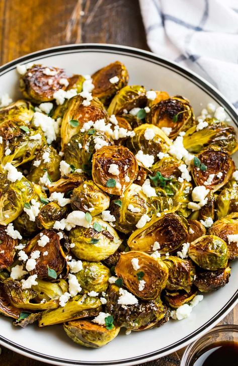 Crispy roasted balsamic Brussels sprouts with feta and honey are the perfect side dish. Enjoy roasted in the oven or made in the air fryer. Healthy Maple Syrup, Recipes Using Maple Syrup, How To Roast Veggies, Snacks For Movie Night, Best Potluck Recipes, Dinner With Rice, Mediterranean Diet Meals, Balsamic Brussels Sprouts, Healthy Quick Meals