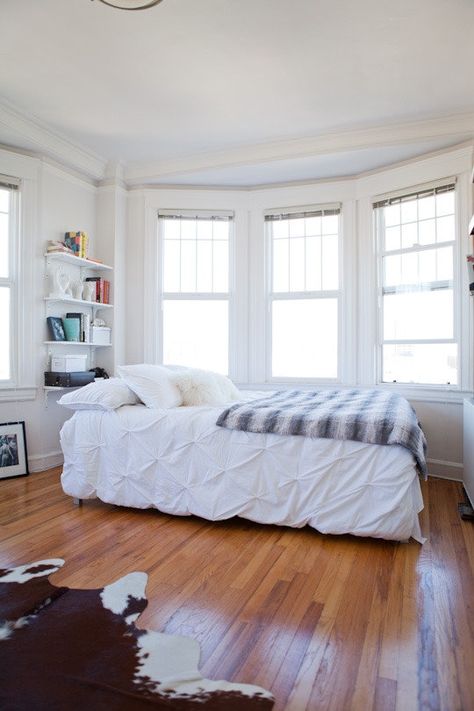 White Apartment, Bay Windows, Relaxing Bedroom, White Sheets, Tiny Apartment, Trendy Bedroom, White Bedroom, White Rug, Bay Window